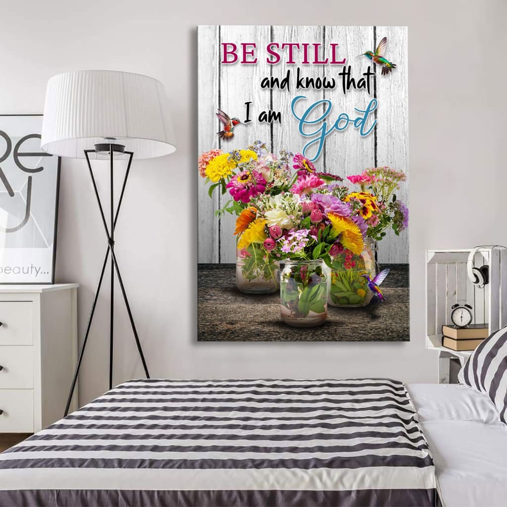 Inspirational canvas with "Be still and know" from Psalm 46:10, adorned with hummingbirds and floral design for faith-filled homes.