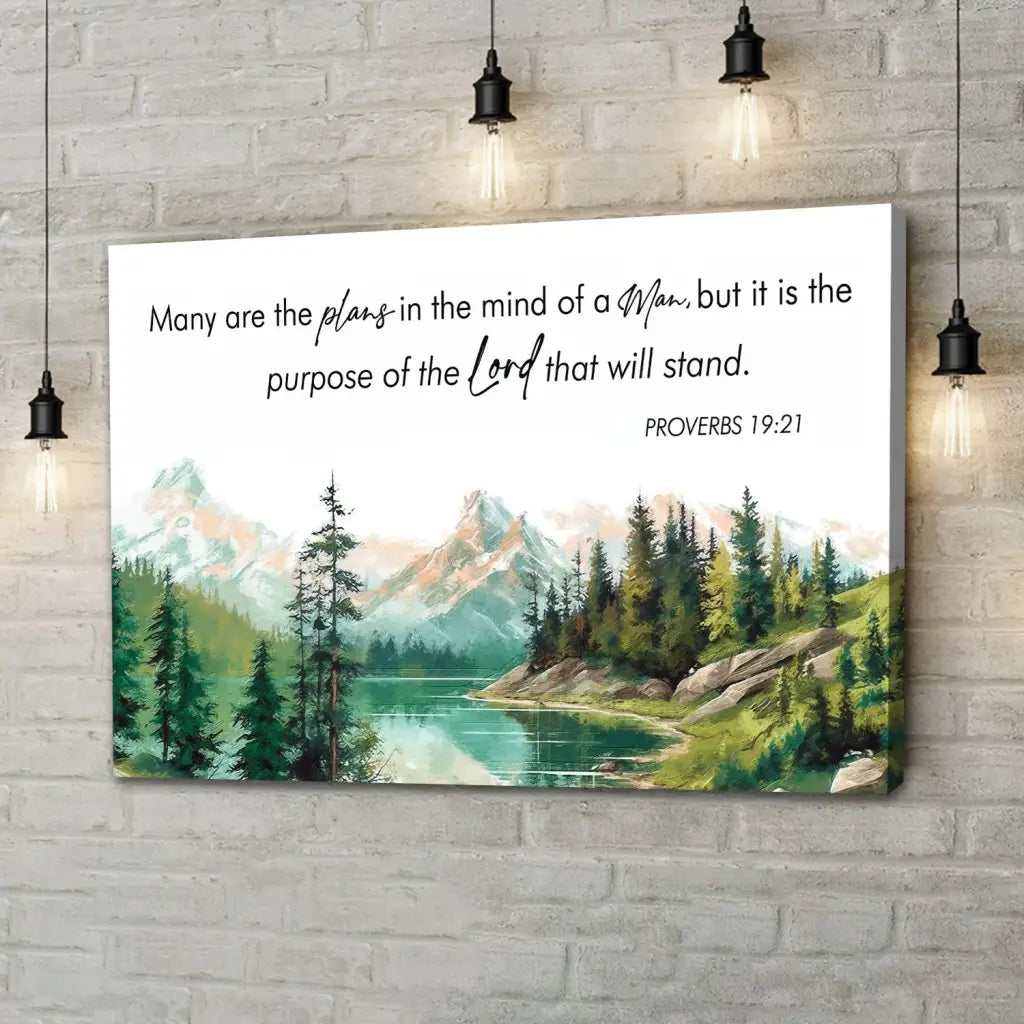 Bible verse wall art with Proverbs 19:21, "Many Are The Plans," tranquil lake and lush pine trees, ideal Christian artwork.