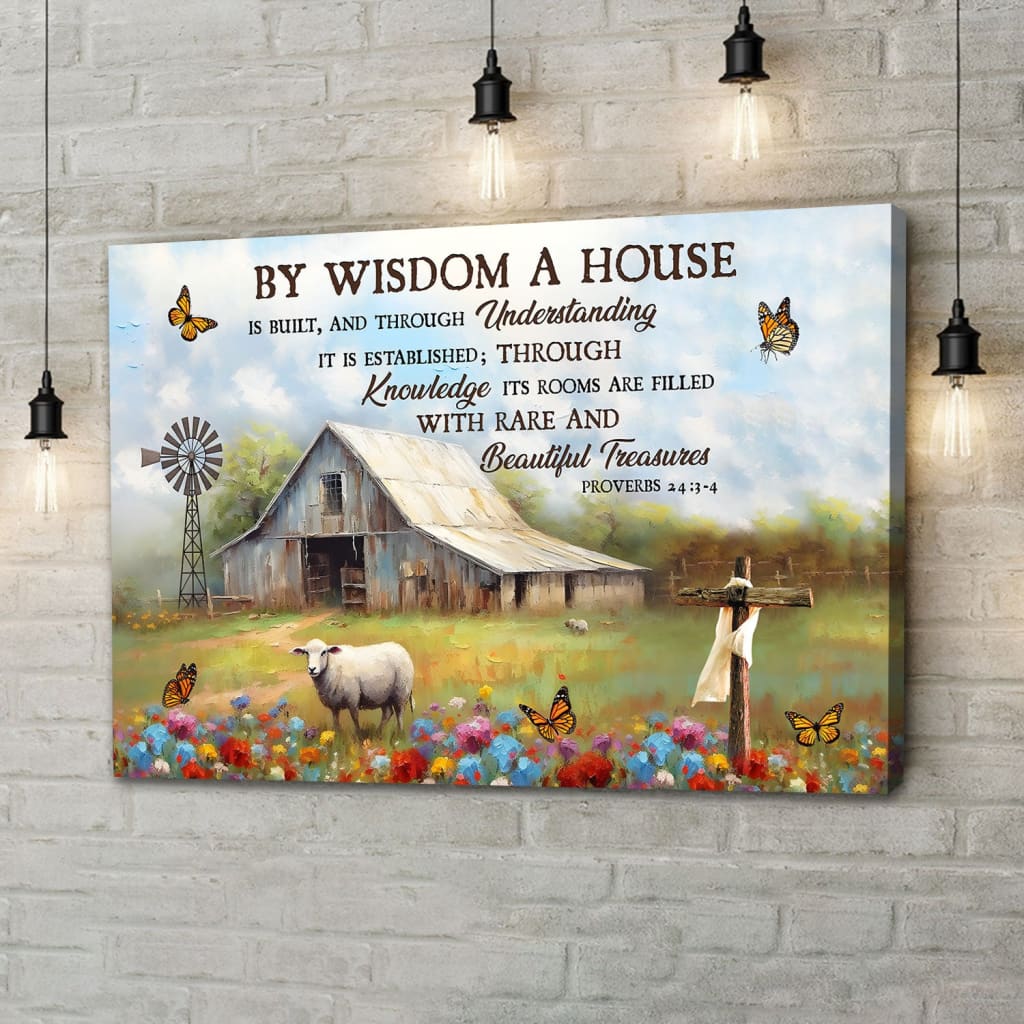 Bible verse wall art canvas featuring Proverbs 24:3-4, "By wisdom a house is built," with an old barn and sheep.