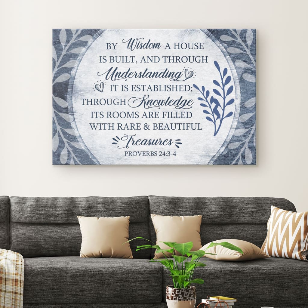 Christian wall art canvas featuring the verse "By Wisdom A House Is Built" adorned with a beautiful leaf border.