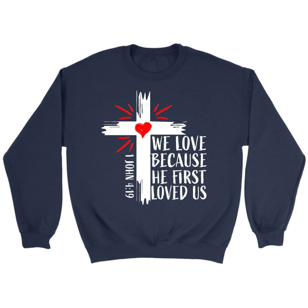 Christian sweatshirts: 1 John 4:19 We love because He first loved us sweatshirt Navy / S