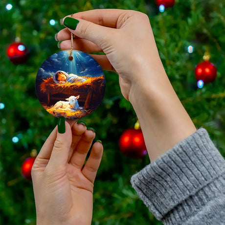 Inspirational ornament featuring baby Jesus in the manger with a lamb, perfect for holiday decor.