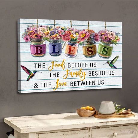 Christian canvas wall art featuring "Bless the Food Before Us" with flowers hanging in jars, perfect faith-based home decor.