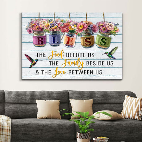 Inspirational canvas print with "Bless the Food Before Us" and flowers in jars, ideal Christian gift for home decor.