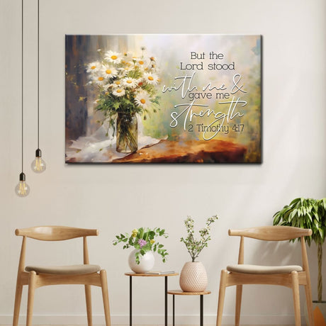 Bible verse wall art featuring 2 Timothy 4:17, "But the Lord Stood With Me and Gave Me Strength," with a vase of daisies, perfect faith-based decor.
