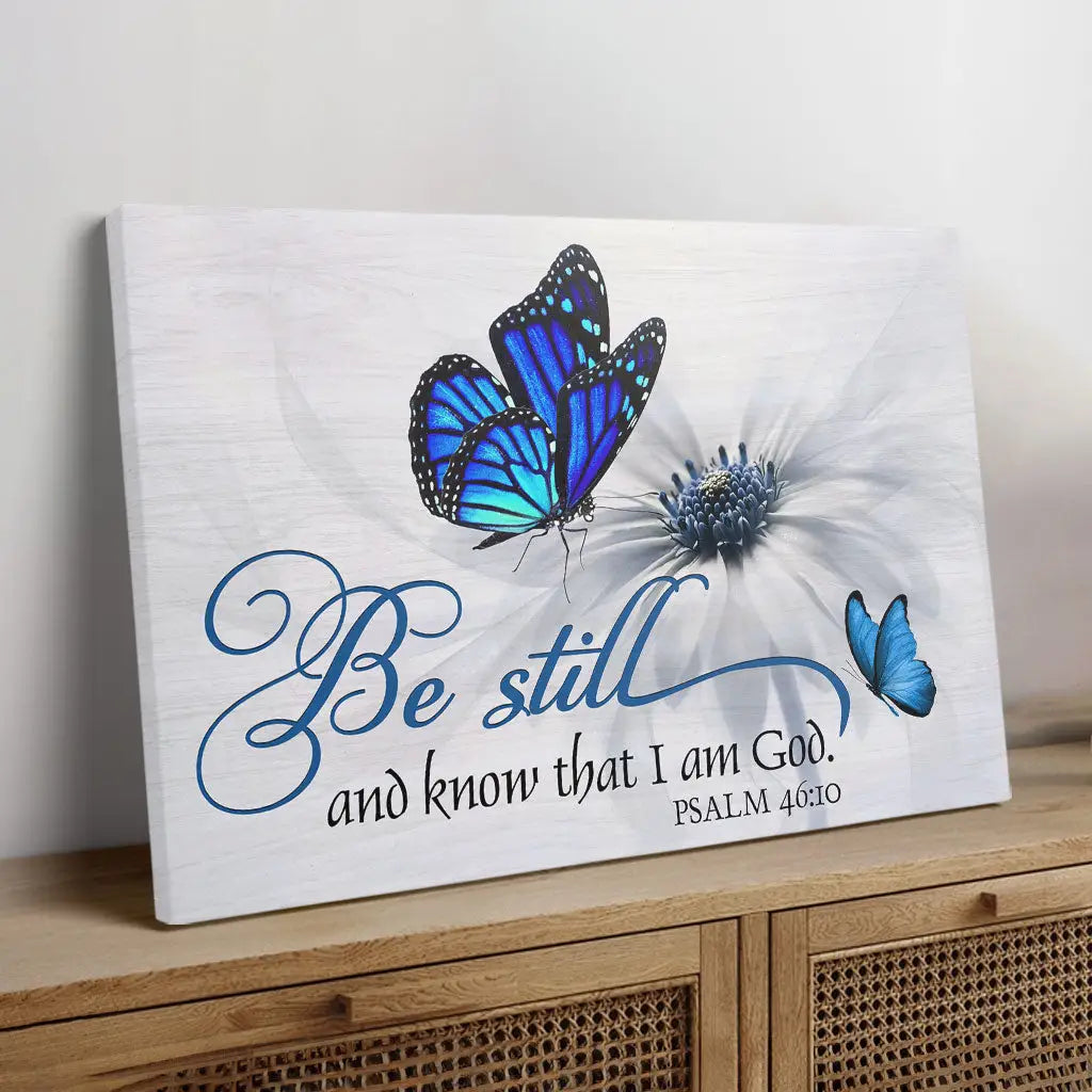 Bible verse wall art featuring Psalm 46:10, "Be Still And Know That I Am God," with butterfly and flower design, perfect faith-based decor.