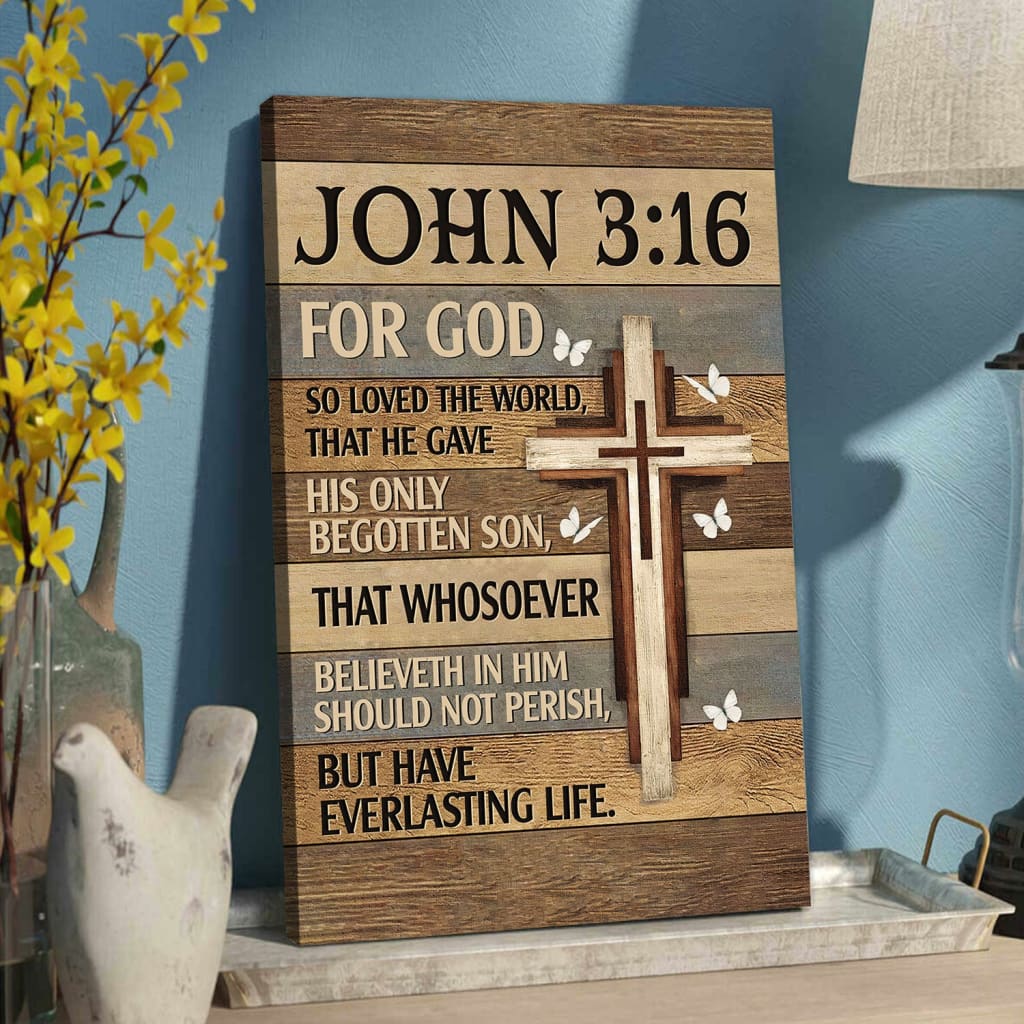 Christian wall art with John 3:16 "For God So Loved the World," featuring a cross and butterflies on a wooden background.