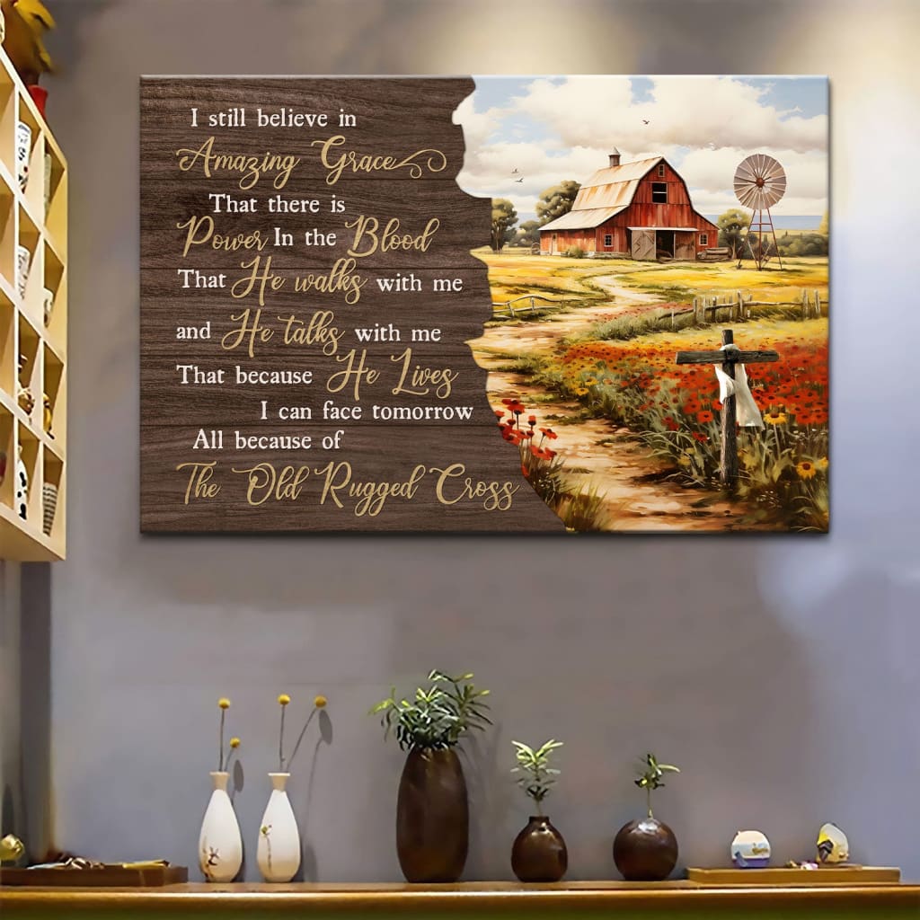 Christian wall art canvas featuring an old red barn on a serene farm with the hymn "I Still Believe in Amazing Grace," perfect for rustic decor.