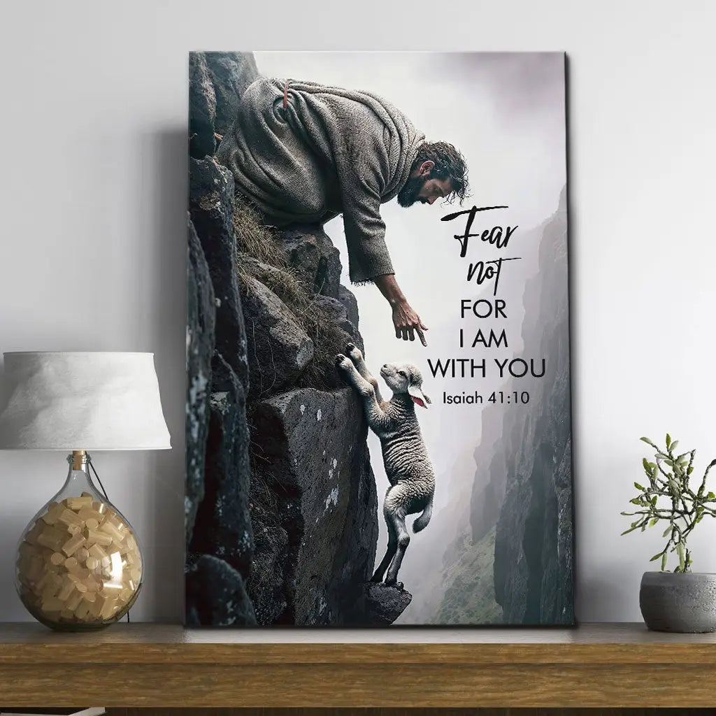 Christian wall art featuring Isaiah 41:10 Bible verse &#39;Fear not for I am with you&#39; with Jesus saving a lamb on a rocky cliff.