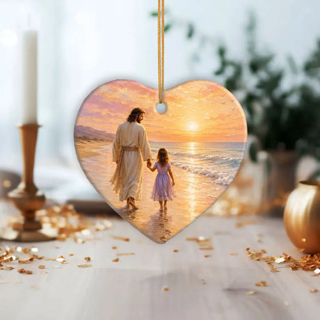 Faith inspired ornament with Jesus and young girl walking on the beach at sunset