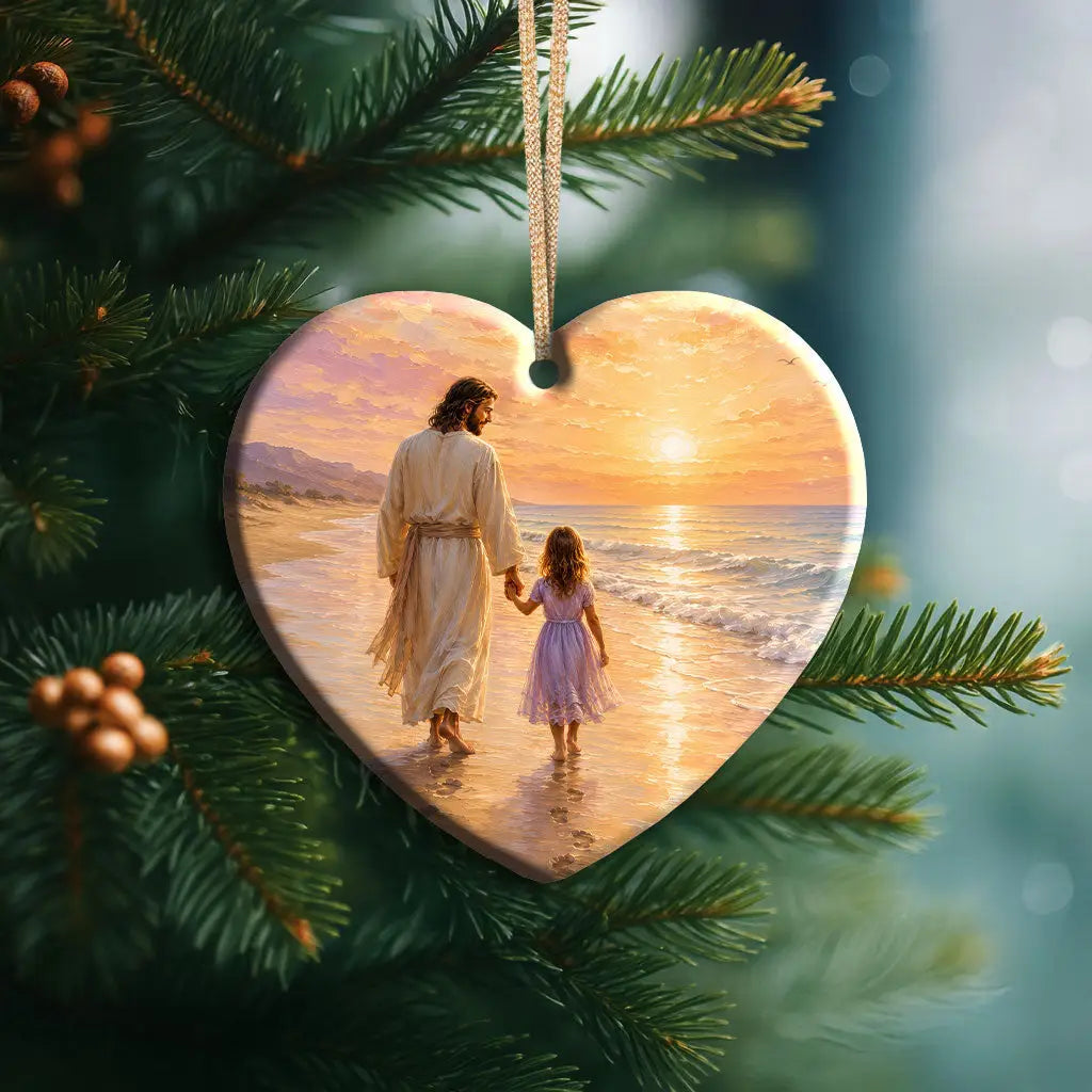 Christian Christmas ornament showing Jesus holding a little girl's hand by the sea