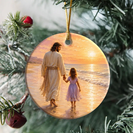 Christian ornament featuring Jesus and little girl walking along the ocean shore