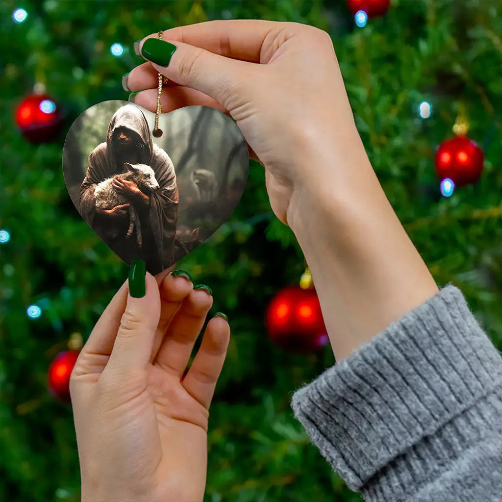 Christian holiday ornament featuring Jesus carrying a lost sheep, perfect for faith-filled gifting.