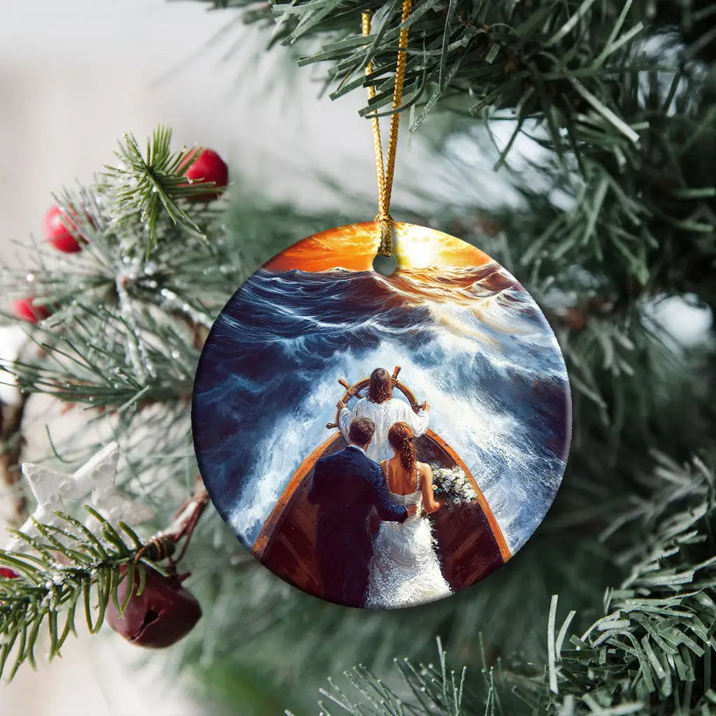 Faith-filled ornament of Jesus taking the wheel, protecting a couple from storms and trials.