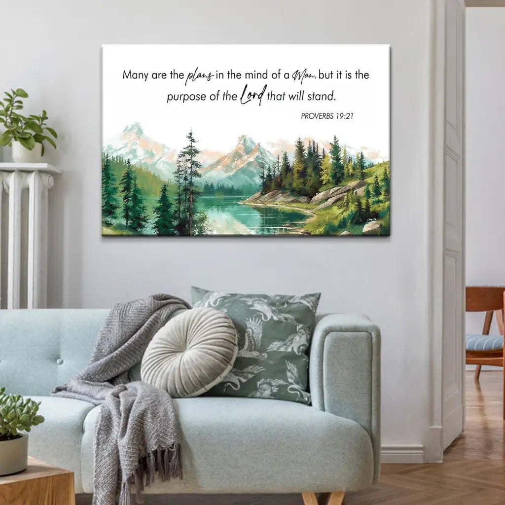 Christian wall art canvas featuring Proverbs 19:21, "Many Are The Plans," with a serene mountain and lake landscape, perfect faith-based decor.