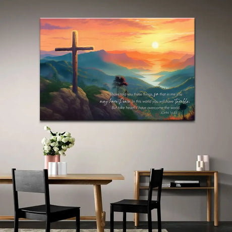 Faith-based decor with John 16:33, a stunning sunset and mountain scene with a cross symbolizing victory in Christ.