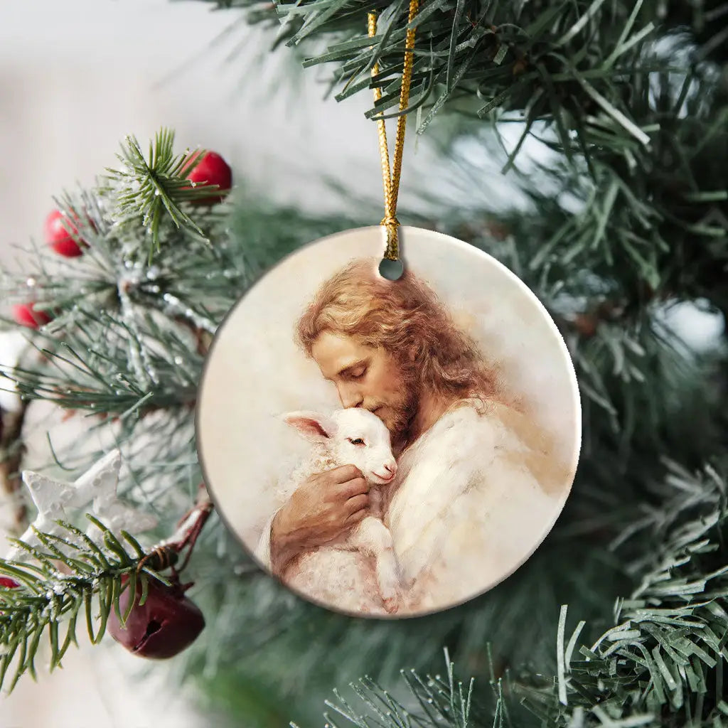 Inspirational ornament showing Jesus carrying a lost sheep, representing grace and salvation.