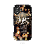 The light shines in the darkness John 1:5 Bible verse phone case Christian gifts iPhone 16 Plus / Tough Case