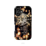 The light shines in the darkness John 1:5 Bible verse phone case Christian gifts iPhone 16 / Tough Case