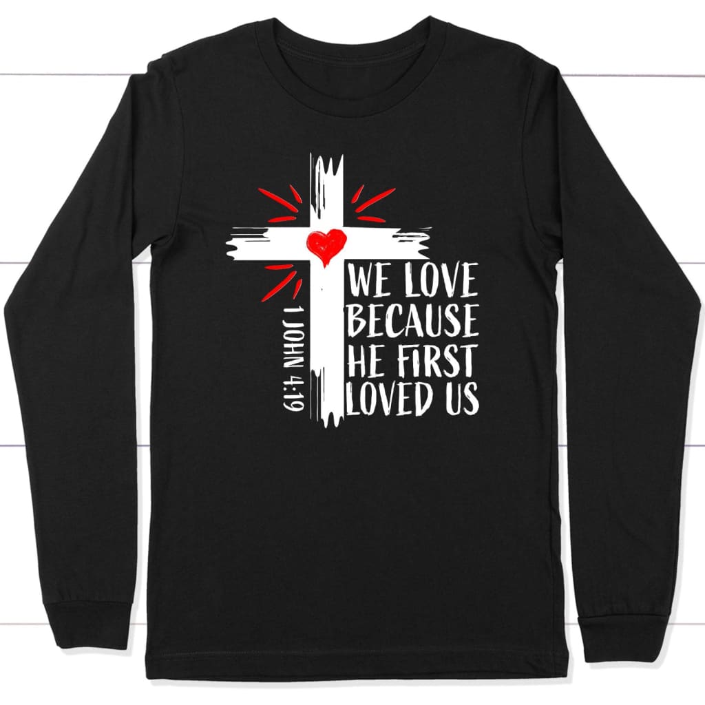 1 John 4:19 NIV We love because He first loved us Christian long sleeve t-shirt Black / S