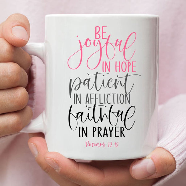 https://christfollowerlife.com/cdn/shop/products/be-joyful-in-hope-patient-affliction-faithful-prayer-christian-coffee-mug-11-oz-834_600x.jpg?v=1661132277