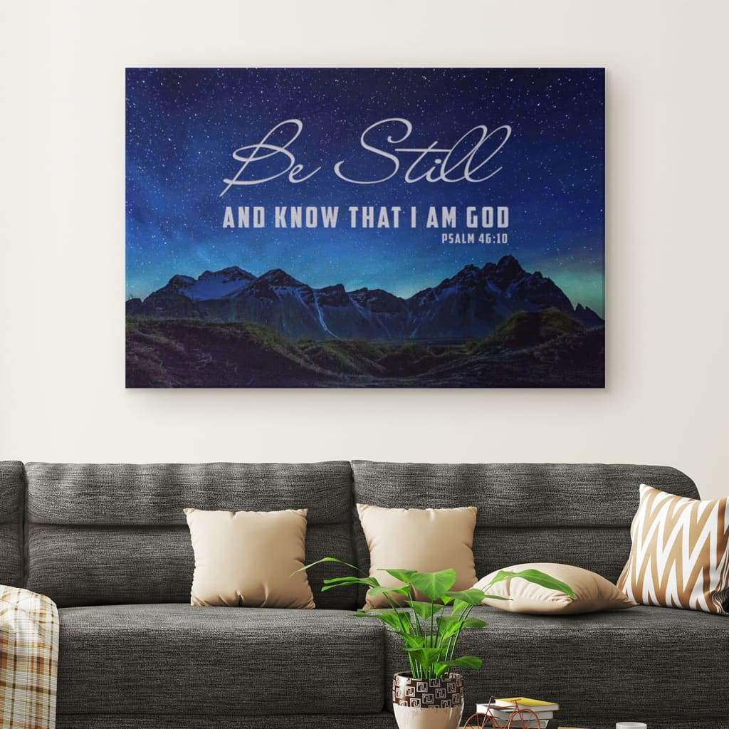 Christian wall art featuring "Be still and know that I am God" Psalm 46:10 with stars over a mountain, faith-based decor.