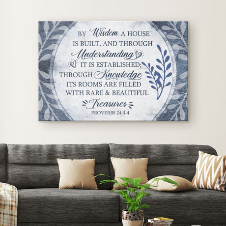 Christian wall art canvas featuring the verse "By Wisdom A House Is Built" adorned with a beautiful leaf border.