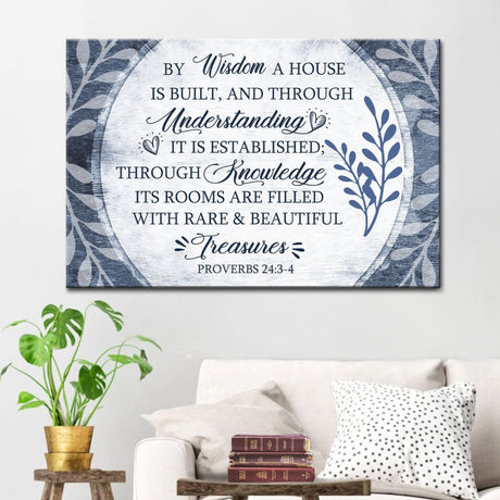 "By Wisdom A House Is Built" wall art canvas with a leaf border, perfect for Christian wall decor.