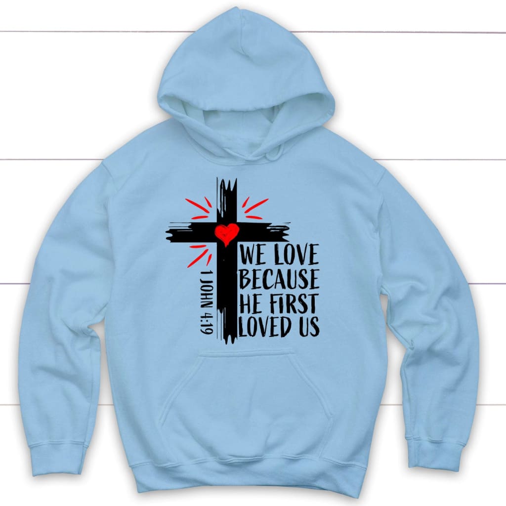 Christian hoodie: 1 John 4:19 We love because he first loved us hoodie Light Blue / S