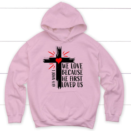 Christian hoodie: 1 John 4:19 We love because he first loved us hoodie Light Pink / S