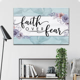 "Faith Over Fear" floral design wall art canvas with teal border, perfect for Christian home decor.