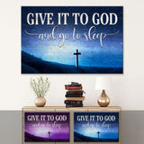 Christian wall art canvas with wooden cross and "Give it to God and go to sleep" saying on blue and purple background.