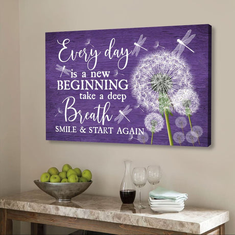 Christian wall art canvas features dragonflies and dandelions with the phrase "Every Day Is A New Beginning" on a purple background.