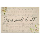 Christian wall decor with "Jesus Paid It All," sheet music, and lilies, great for faith-filled inspiration.