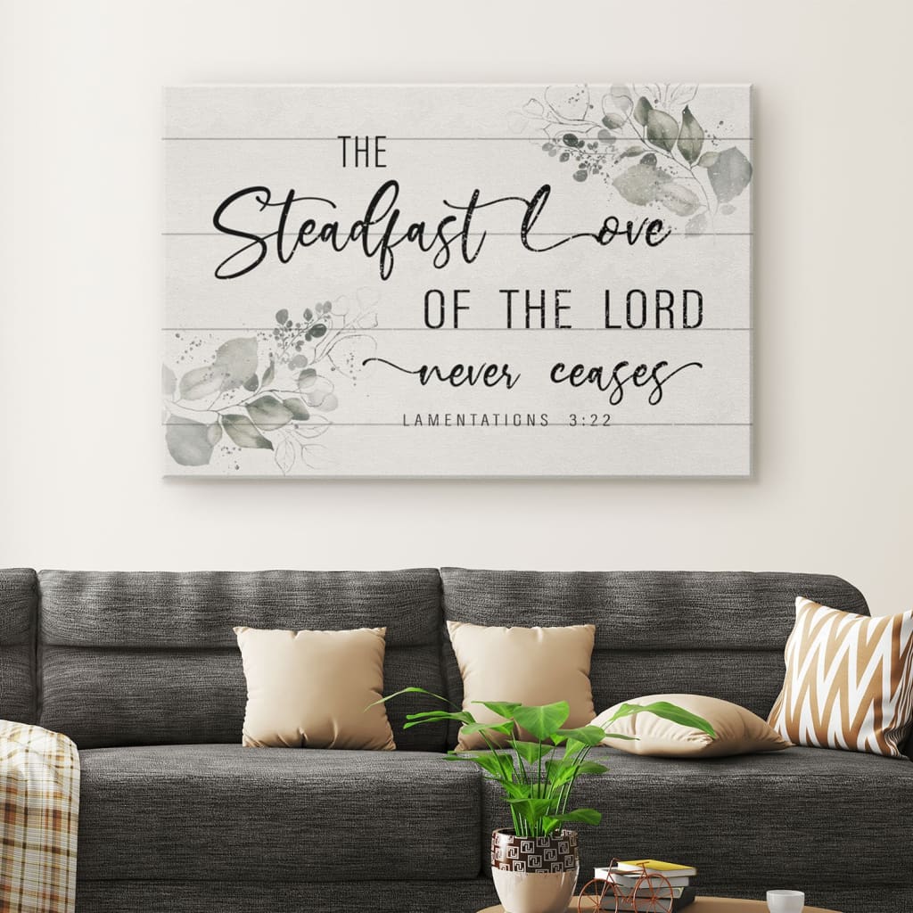 Christian canvas featuring Lamentations 3:22, "The steadfast love of the Lord never ceases," with a floral border, inspirational decor.