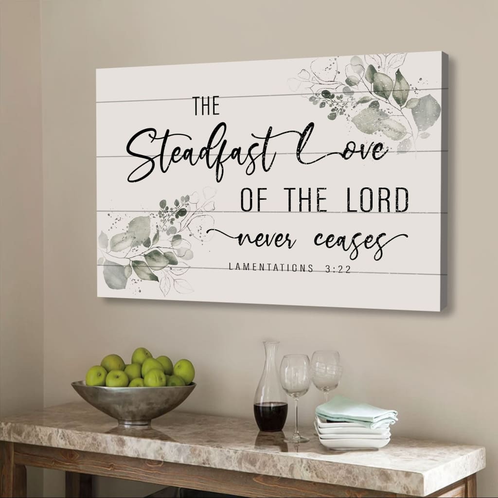 Bible verse wall art with "The steadfast love of the Lord never ceases" Lamentations 3:22, floral border, Christian decor.