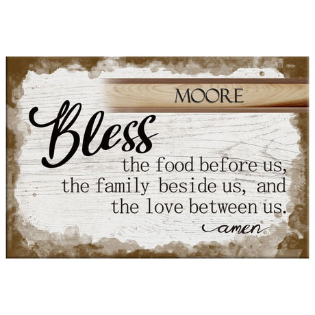 Customizable wall art with "Bless the Food Before Us" and family name, great for Christian home décor.