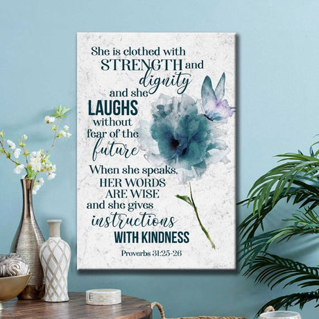 Bible verse wall art canvas featuring Proverbs 31:25-26 NLT, "She Is Clothed With Strength And Dignity," a beautiful piece for Christian decor.