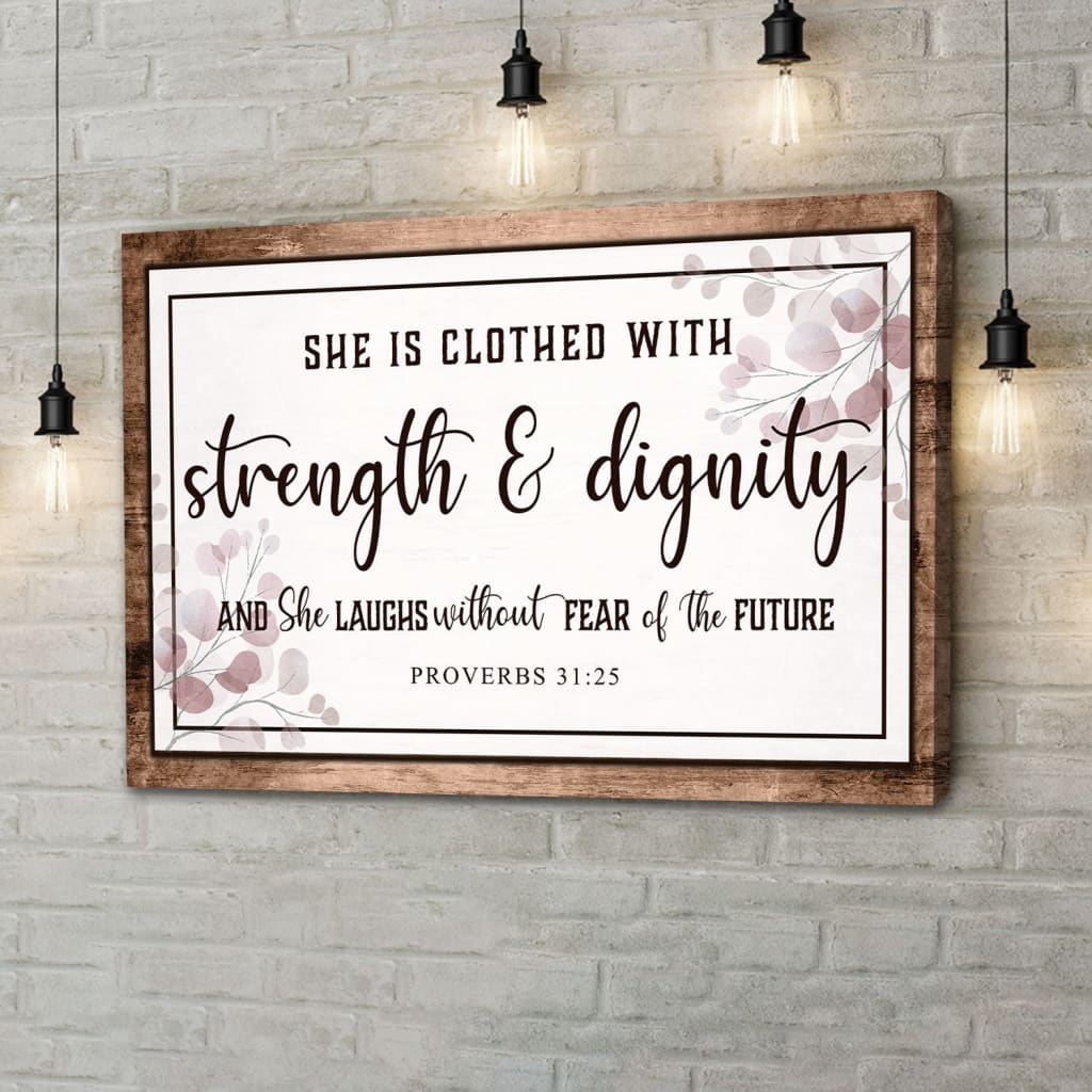 Proverbs 31:25 wall art with "She is clothed with strength & dignity," Christian decor with brown wooden border.