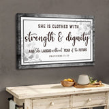 Inspirational Bible verse wall art, "She is clothed with strength & dignity," Proverbs 31:25, Gray wood border.