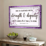 Christian wall art canvas featuring "She is clothed with strength & dignity," Proverbs 31:25, with rustic Purple wooden border.
